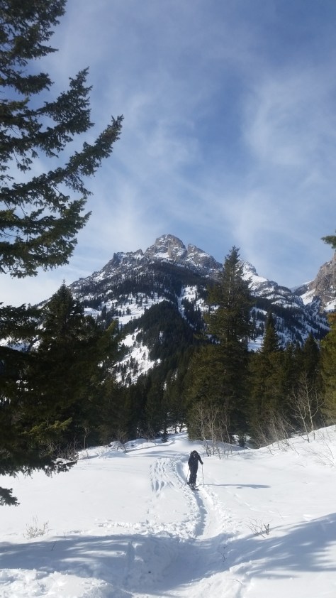Noah making his way off the moraine with Shadow in the background.